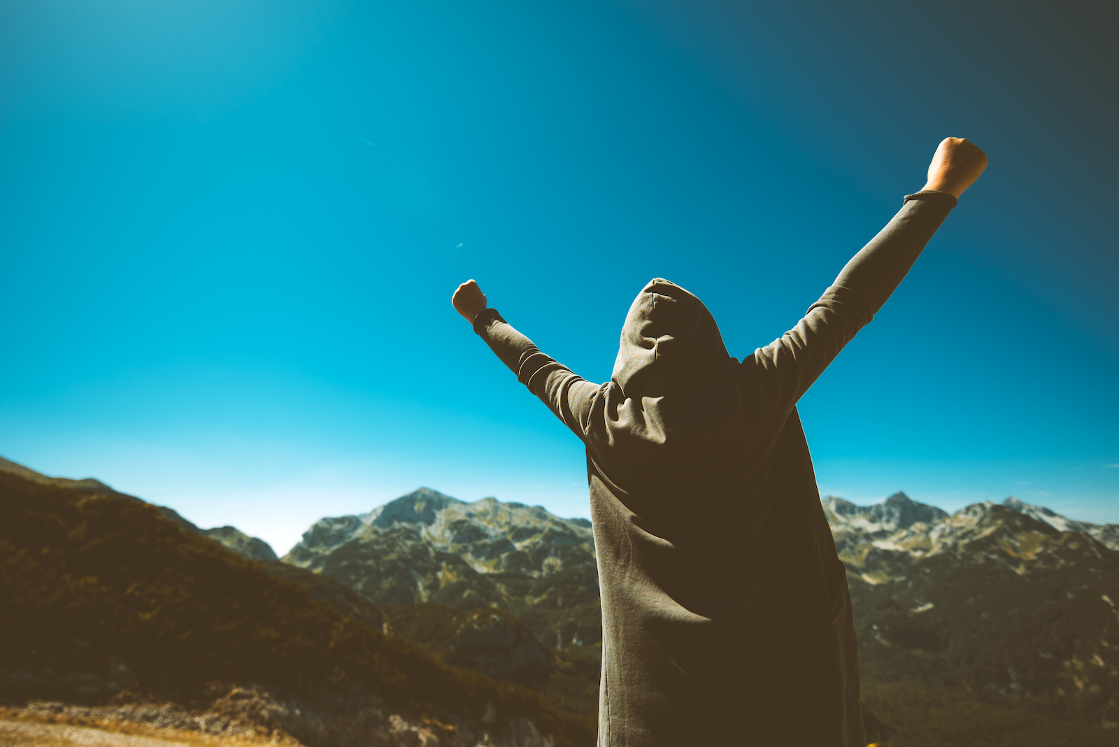 victorious-female-person-on-mountain-top-PX4LZRG copy